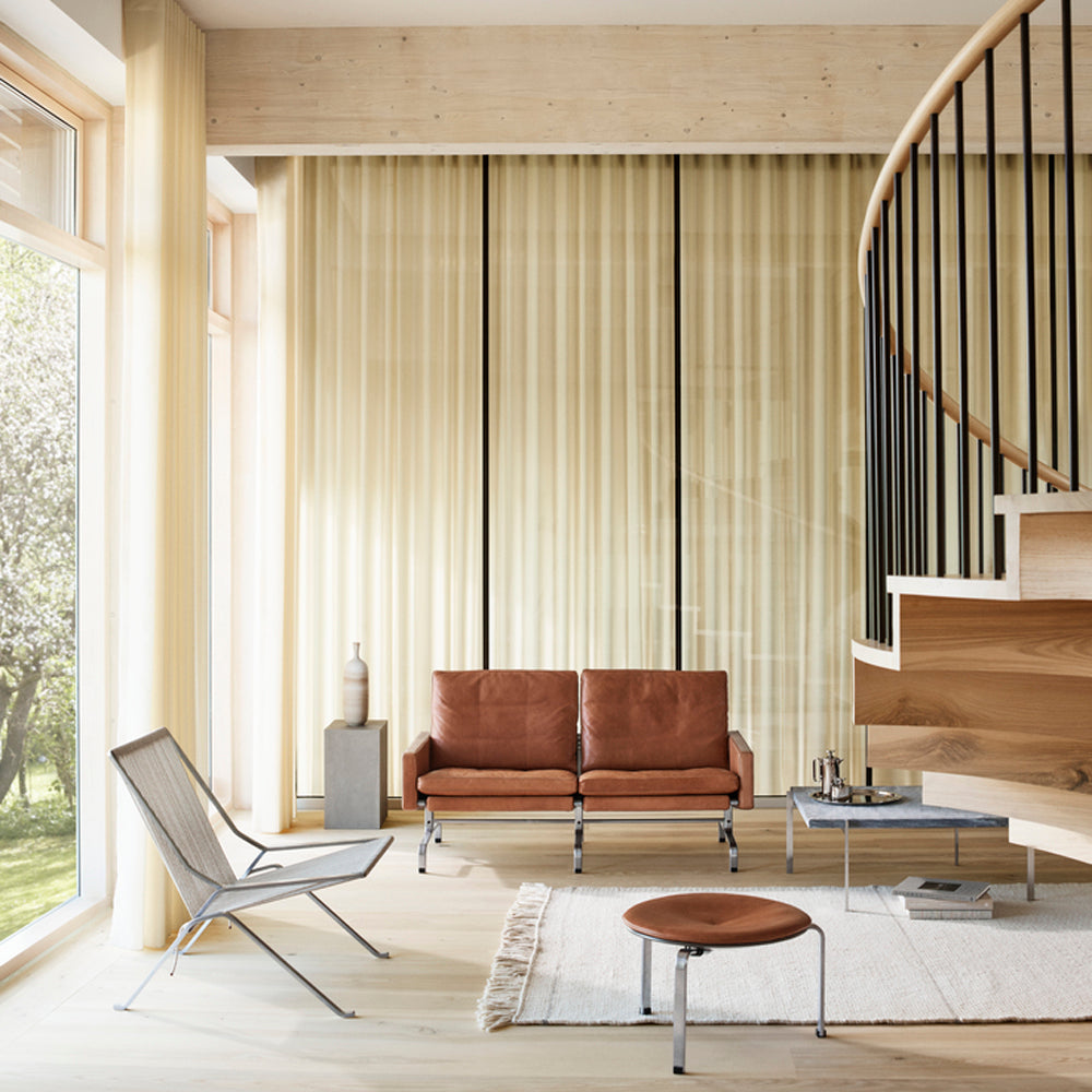 PK61 Coffee Table by Fritz Hansen, showing pk61 coffee table in live shot.