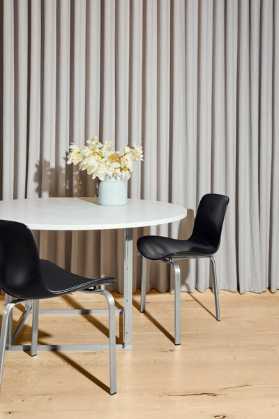 PK8 Chair by Fritz Hansen, showing pk8 chair in live shot.