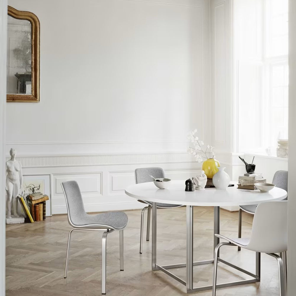 PK8 Chair by Fritz Hansen, showing pk8 chair in live shot.