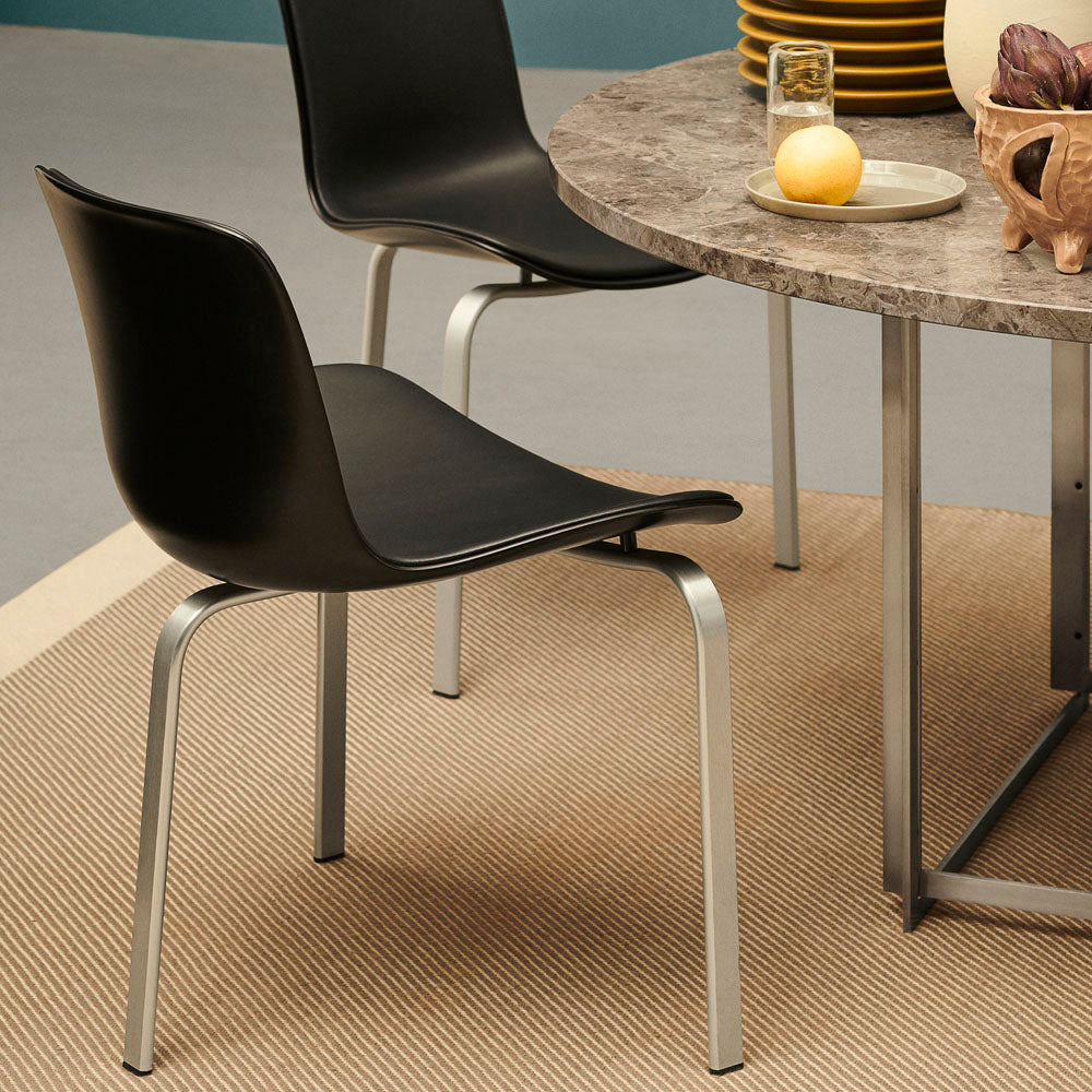 PK8 Chair by Fritz Hansen, showing pk8 chair in live shot.