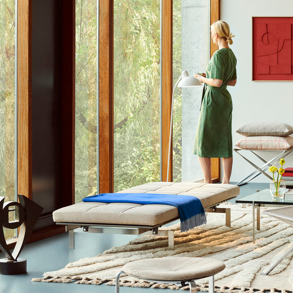 PK80 Daybed by Fritz Hansen, showing pk80 daybed in live shot.