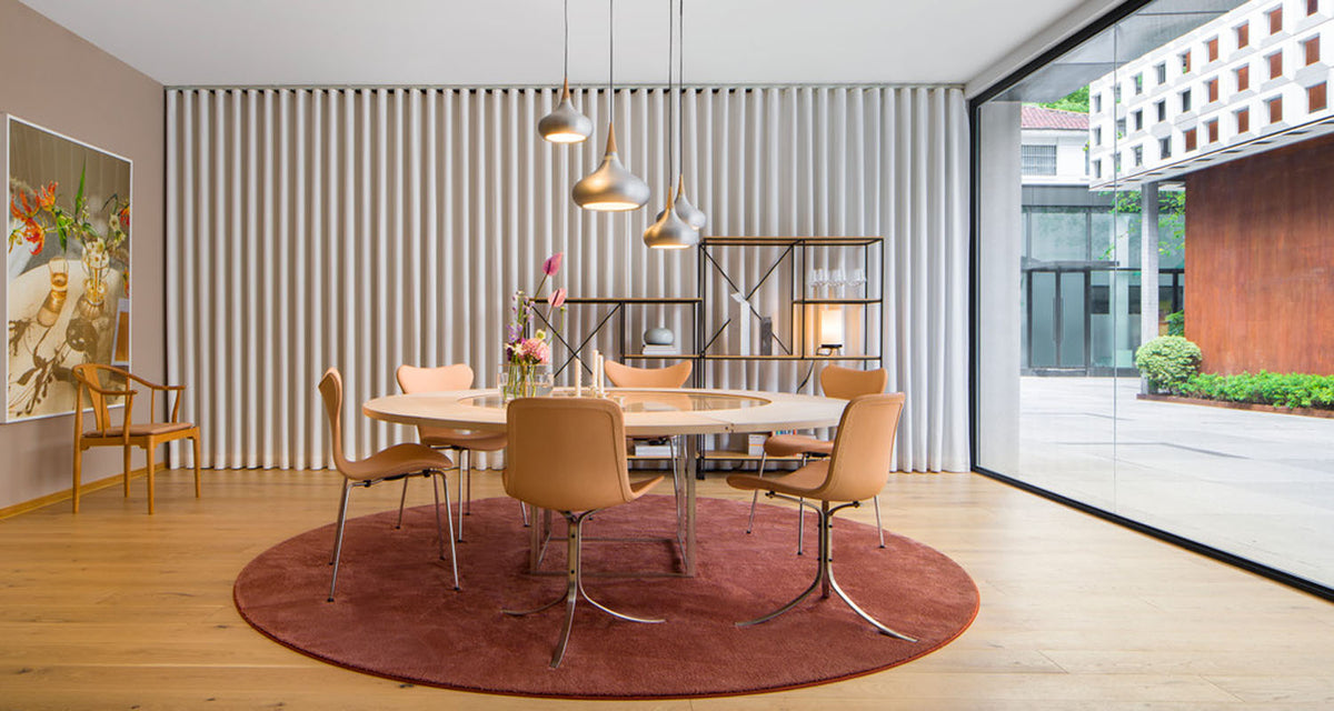 PK9 Chair by Fritz Hansen, showing pk9 chair in live shot.