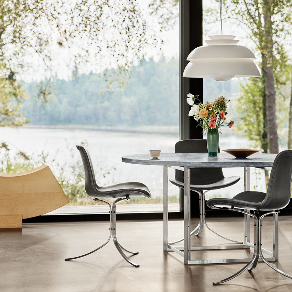 PK9 Chair by Fritz Hansen, showing pk9 chair in live shot.