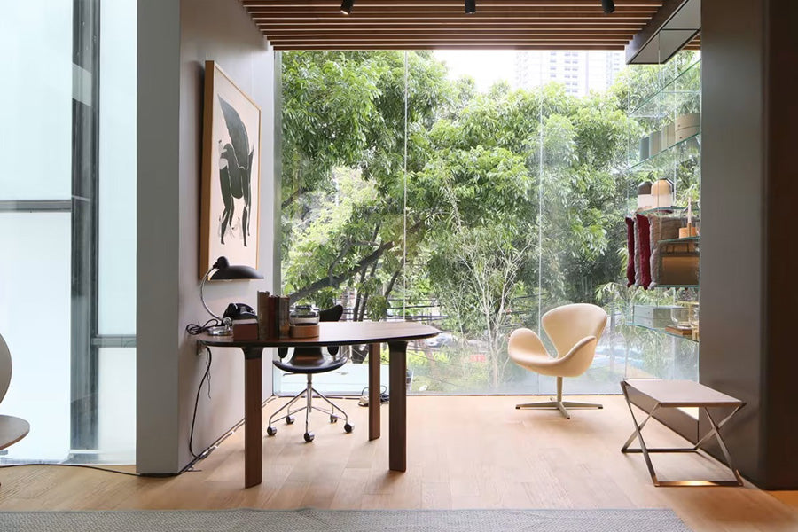 PK91 Folding Stool by Fritz Hansen, showing pk91 folding stool in live shot.