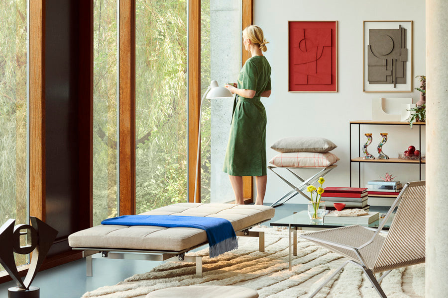 PK91 Folding Stool by Fritz Hansen, showing pk91 folding stool in live shot.