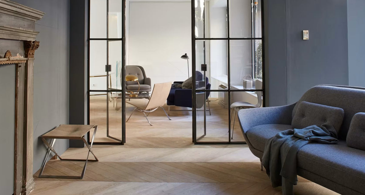 PK91 Folding Stool by Fritz Hansen, showing pk91 folding stool in live shot.