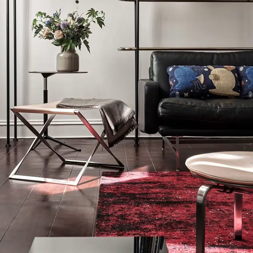 PK91 Folding Stool by Fritz Hansen, showing pk91 folding stool in live shot.