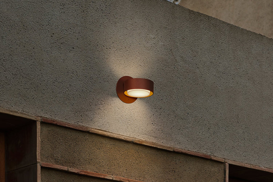 Plaff-On IP65 Outdoor Wall/Ceiling Lamp by Marset, showing plaff-on ip65 outdoor wall/ceiling lamp in live shot.