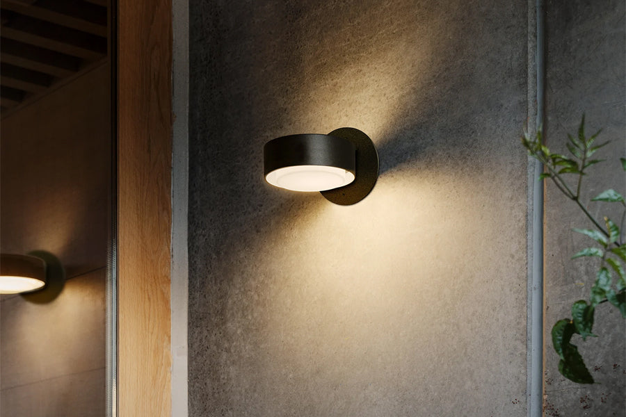Plaff-On IP65 Outdoor Wall/Ceiling Lamp by Marset, showing plaff-on ip65 outdoor wall/ceiling lamps in live shot.