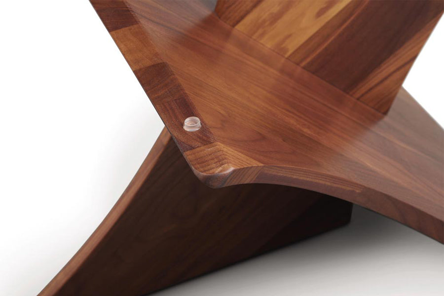 Planes Coffee Table by Copeland Furniture, showing closeup view of planes coffee table in natural walnut/clear glass.
