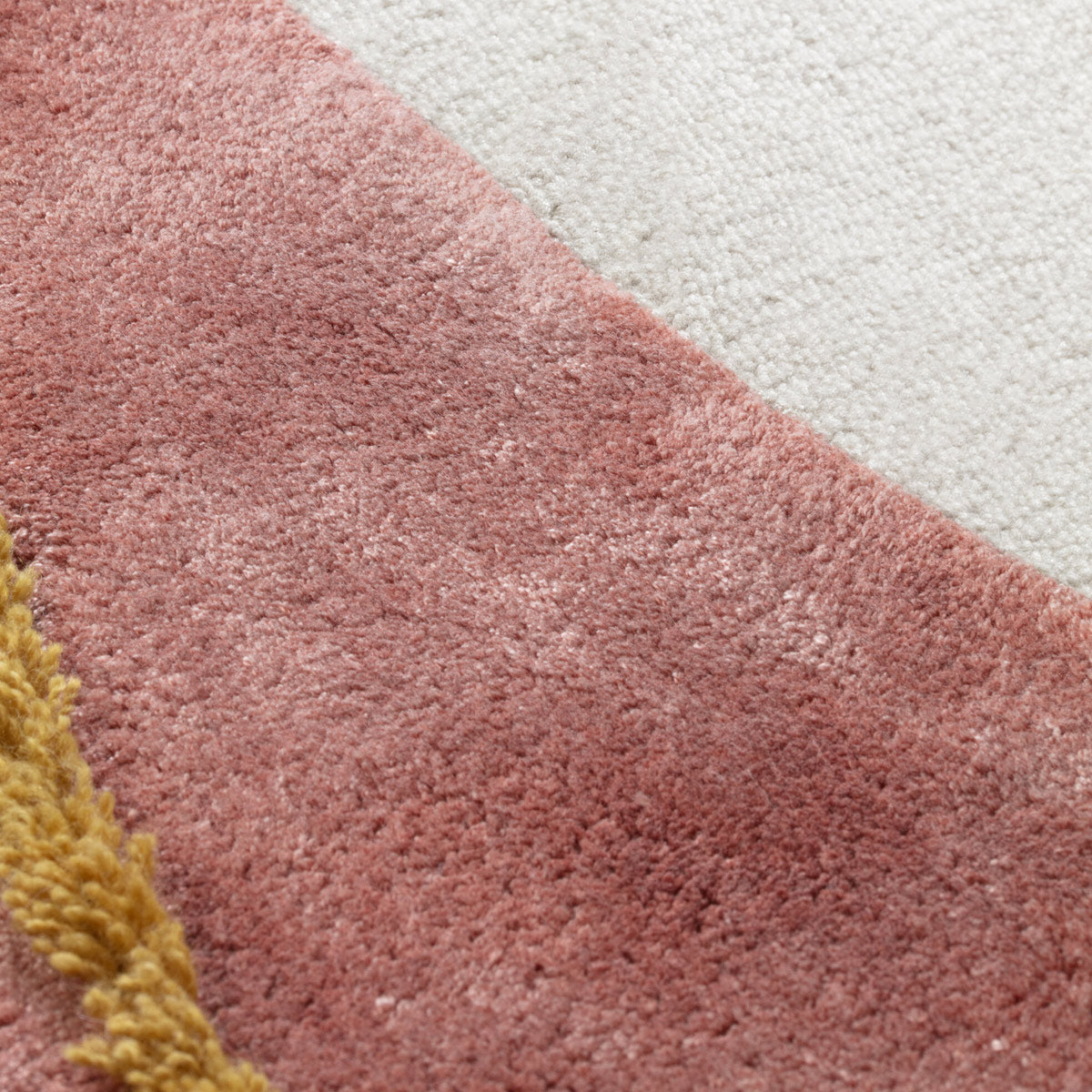 Play Hand Tufted Rug by Ligne Pure, showing closeup view of play hand tufted rug in live shot.