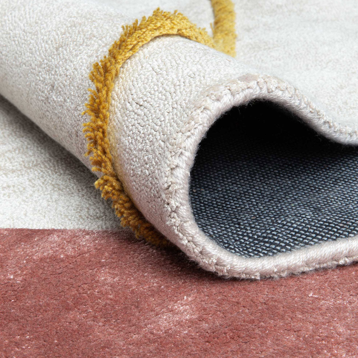 Play Hand Tufted Rug by Ligne Pure, showing closeup view of play hand tufted rug in live shot.