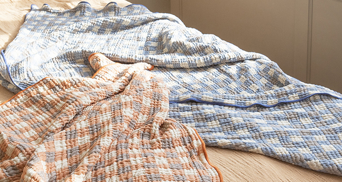 Pomme Recycled Cotton Blanket by Brita, showing pomme recycled cotton blanket in live shot.