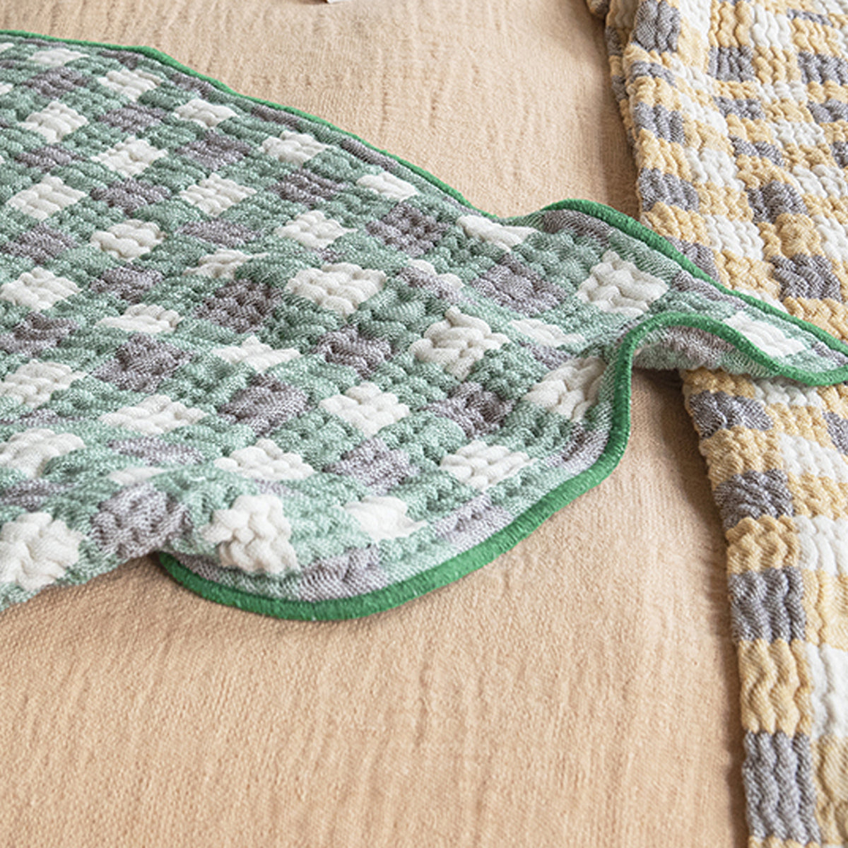 Pomme Recycled Cotton Blanket by Brita, showing closeup view of pomme recycled cotton blanket.