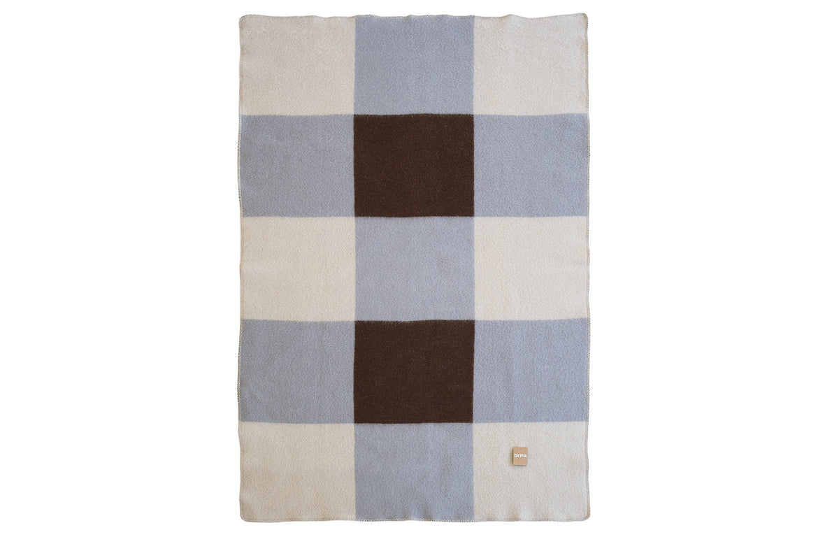 Pop Wool Blanket by Brita, showing angle view of pop wool blanket.