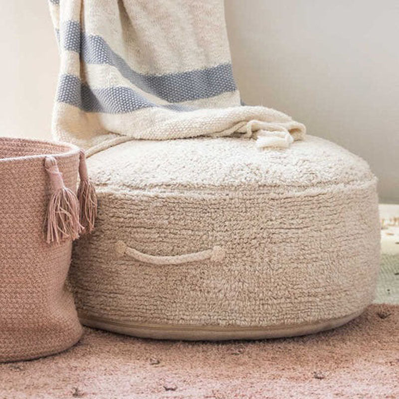 Filler Pouf by Lorena Canals, showing filler pouf rug in live shot.