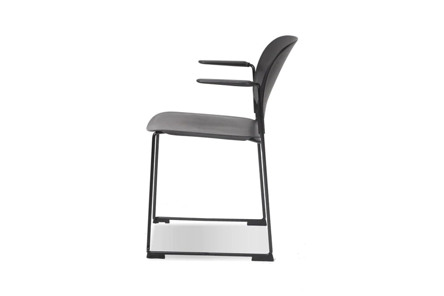 Pringle Stackable Dining Chair by Mobital, showing side view of pringle stckable dining chair in with arm/black.