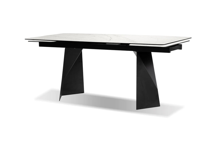 Prism Extending Dining Table by Mobital, showing angle view of prism extending dining table in white carrara ceramic/black powder coated without extended.