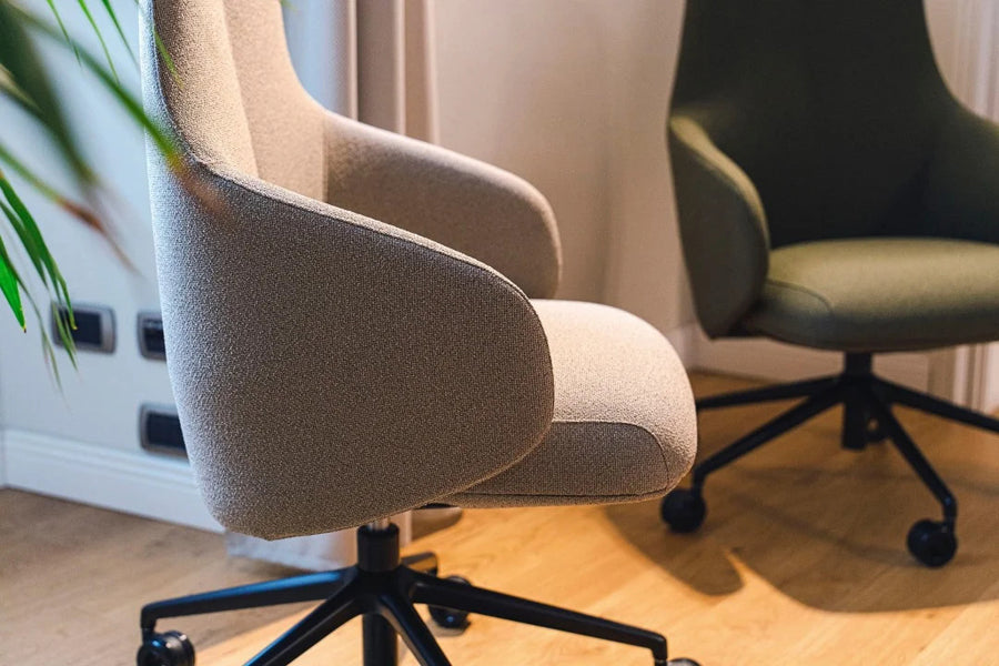 Quinta Swivel Office Armchair by Kollektiff, showing closeup view of quinta swivel office armchairs in live shot.