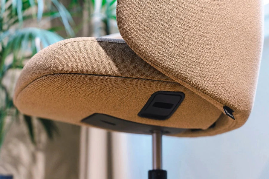 Quinta Swivel Office Armchair by Kollektiff, showing closeup view of quinta swivel office armchair in live shot.