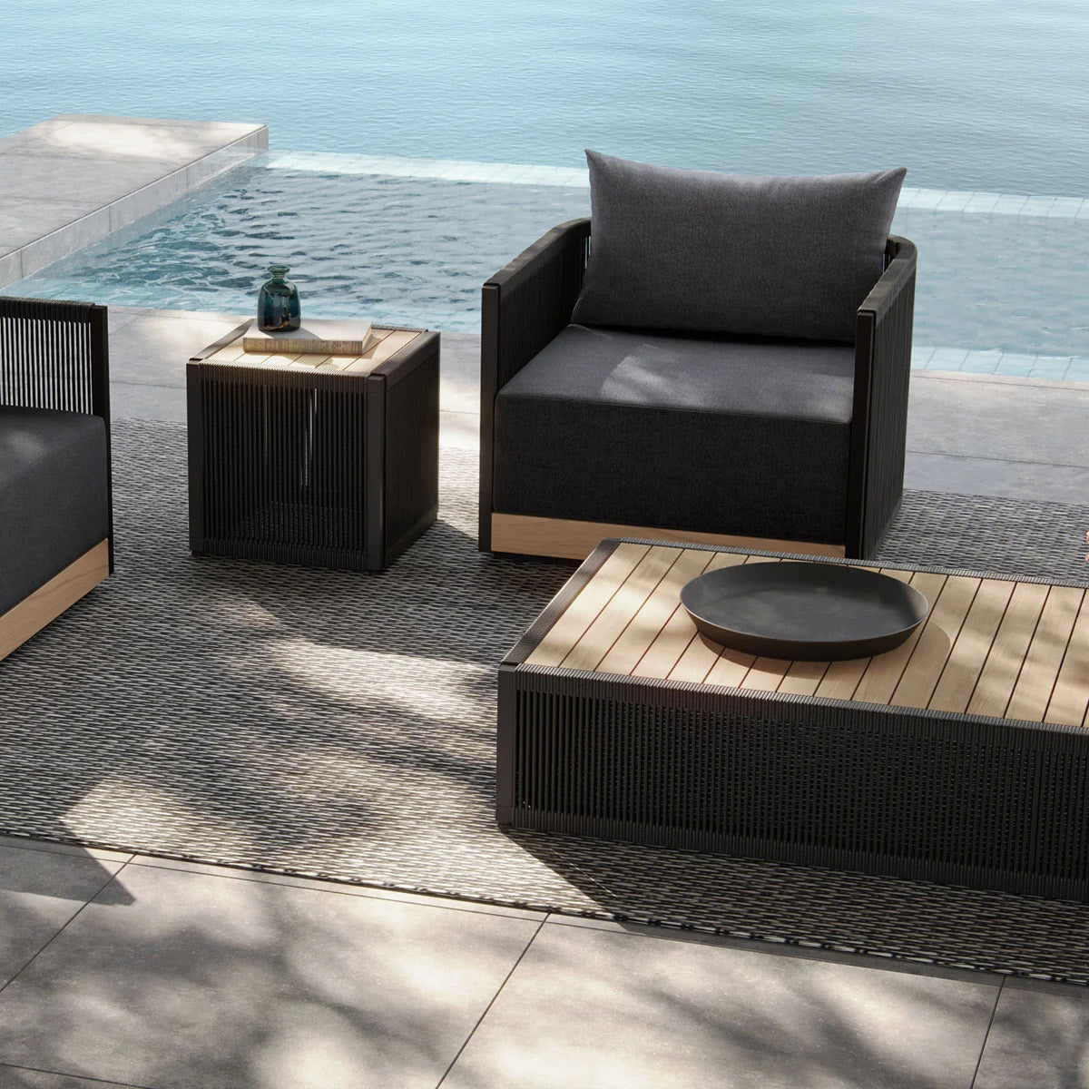 Ravelle Outdoor Coffee Table by Viesso, showing closeup view of ravelle outdoor coffee table in live shot.