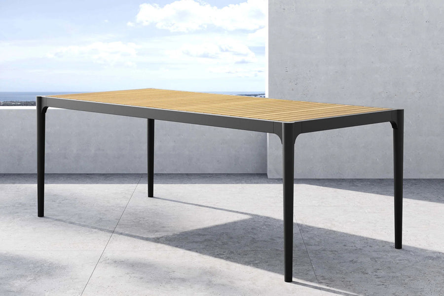 Ravelle Outdoor Dining Table by Viesso, showing ravelle outdoor dining table in live shot.
