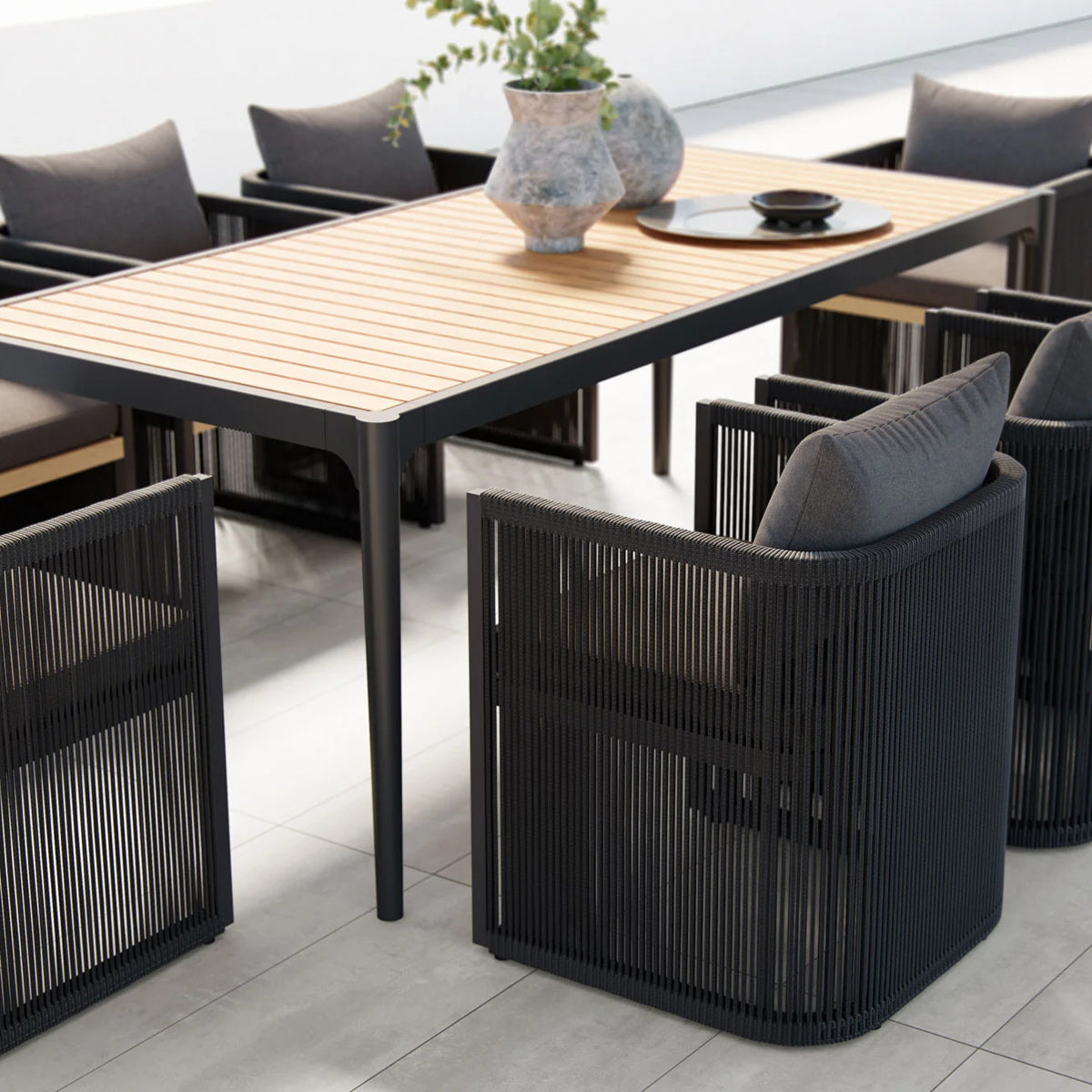 Ravelle Outdoor Dining Table by Viesso, showing closeup view of ravelle outdoor dining table in live shot.