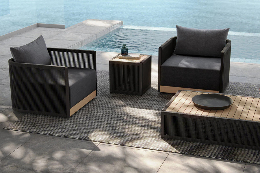 Ravelle Outdoor Side Table by Viesso, showing ravelle outdoor side table in live shot.