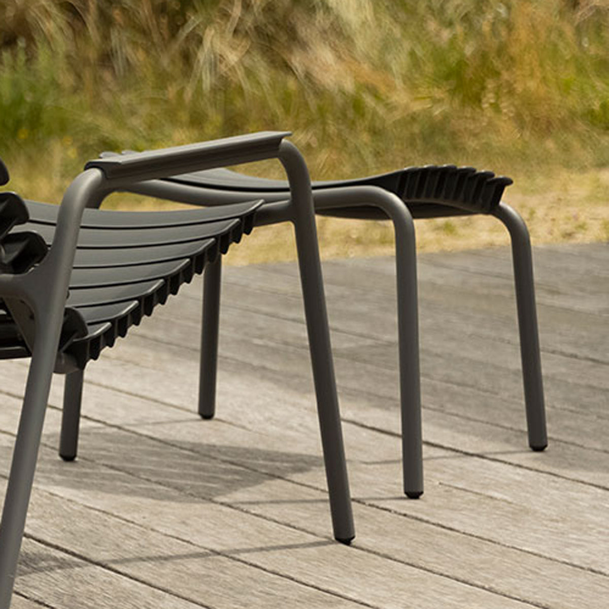 Reclips Outdoor Footrest by Houe, showing reclips outdoor footrest in live shot.