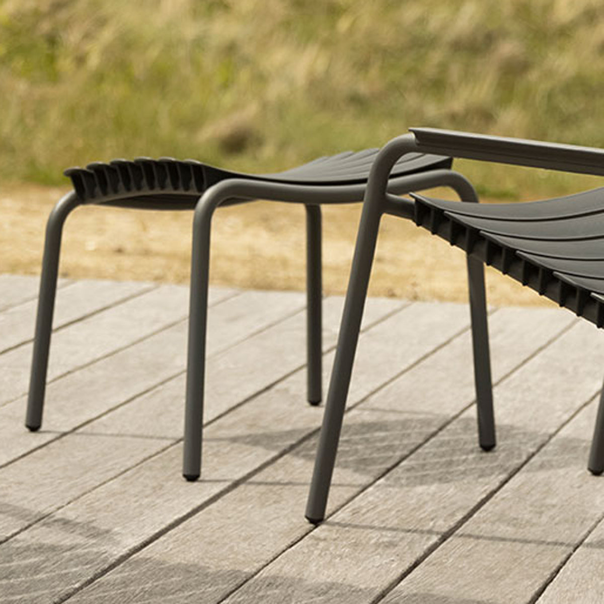 Reclips Outdoor Footrest by Houe, showing reclips outdoor footrest in live shot.