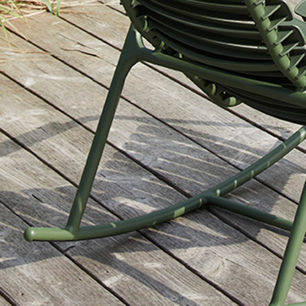 Reclips Outdoor Rocking Chair by Houe, showing closeup view of reclips outdoor rocking chair in live shot.