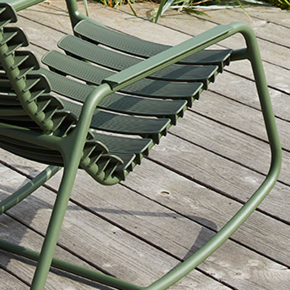 Reclips Outdoor Rocking Chair by Houe, showing closeup view of reclips outdoor rocking chair in live shot.