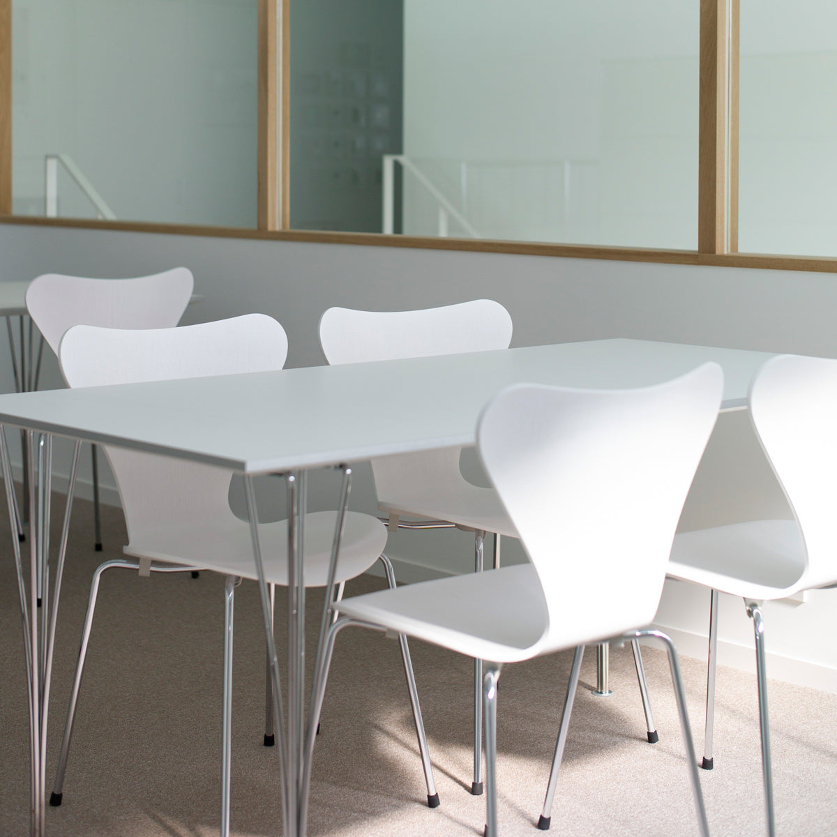 Rectangular Table by Fritz Hansen, showing rectangular tables in live shot.