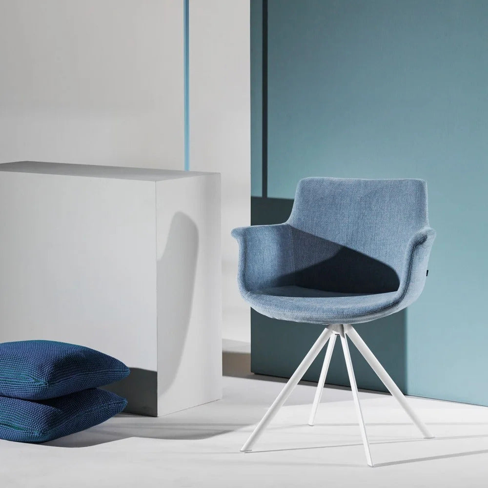 Rego Ellipse Swivel Armchair by B&T, showing rego ellipse swivel armchair in live shot.