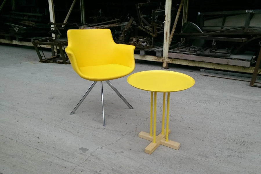 Rego Ellipse Swivel Armchair by B&T, showing rego ellipse swivel armchair in live shot.