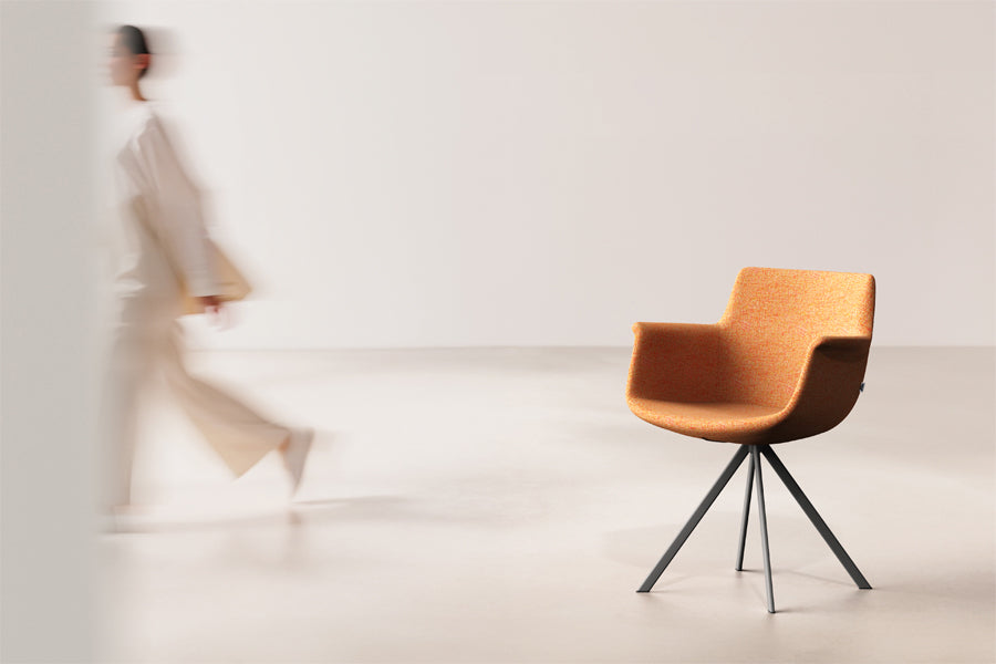 Rego Ellipse Swivel Armchair by B&T, showing rego ellipse swivel armchair in live shot.