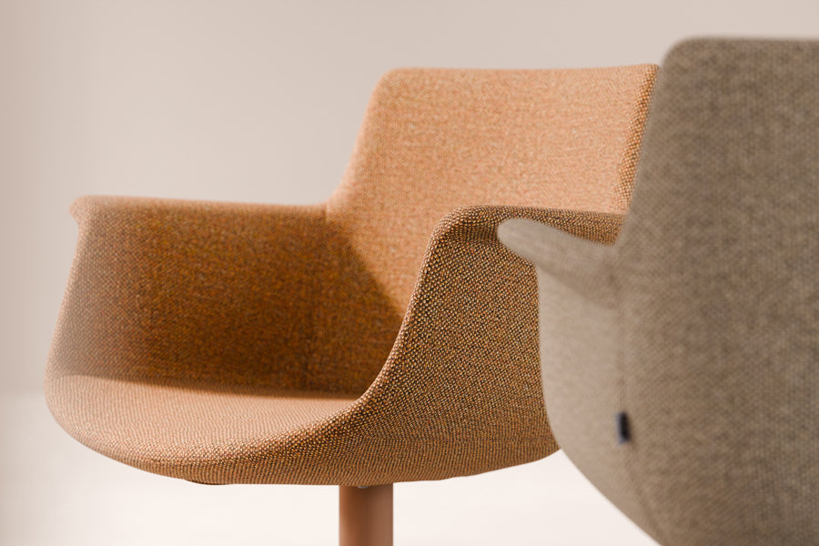 Rego Premium Swivel Armchair by B&T, showing closeup view of rego premium swivel armchairs in live shot.