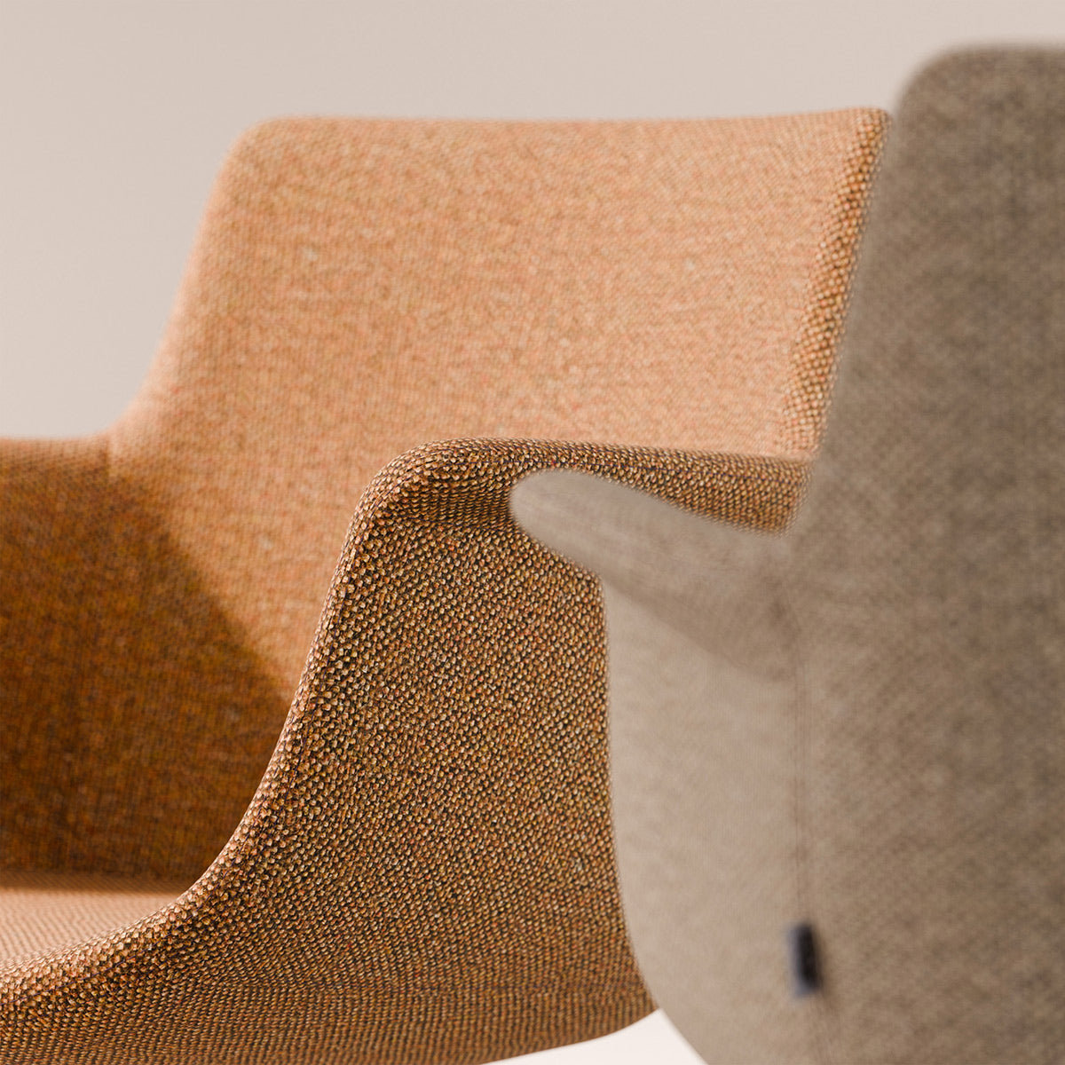Rego Sled Armchair by B&T, showing closeup view of rego sled armchairs in live shot.