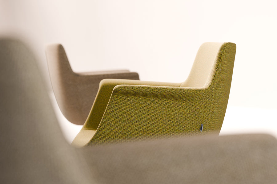 Rego Sled Armchair by B&T, showing closeup view of rego sled armchairs in live shot.