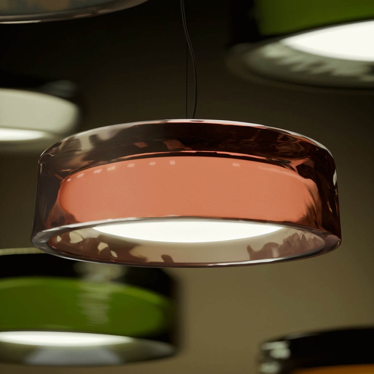 Ringo Pendant Light by Marset, showing closeup view of ringo pendant lights in live shot.