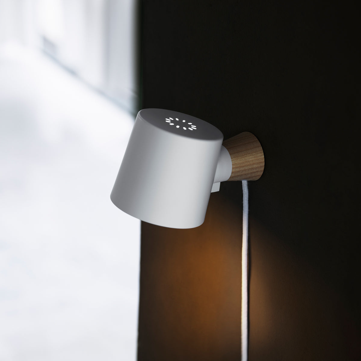 Rise Wall Lamp by Normann Copenhagen, showing rise wall lamp in live shot.