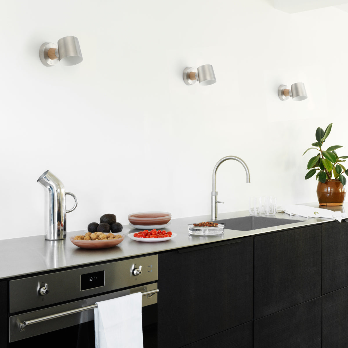 Rise Wall Lamp by Normann Copenhagen, showing rise wall lamps in live shot.