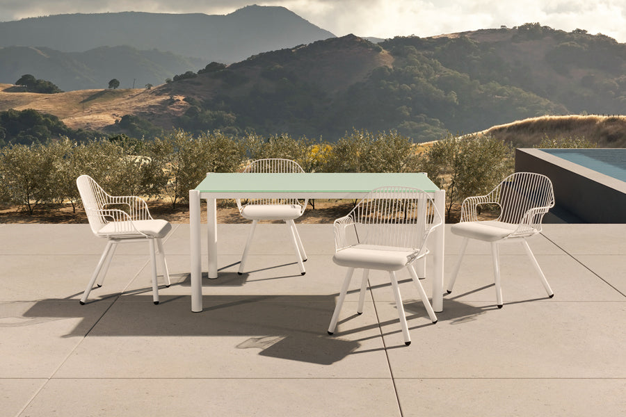 Rita Arm Chair by Bend, showing rita arm chairs with table in live shot.