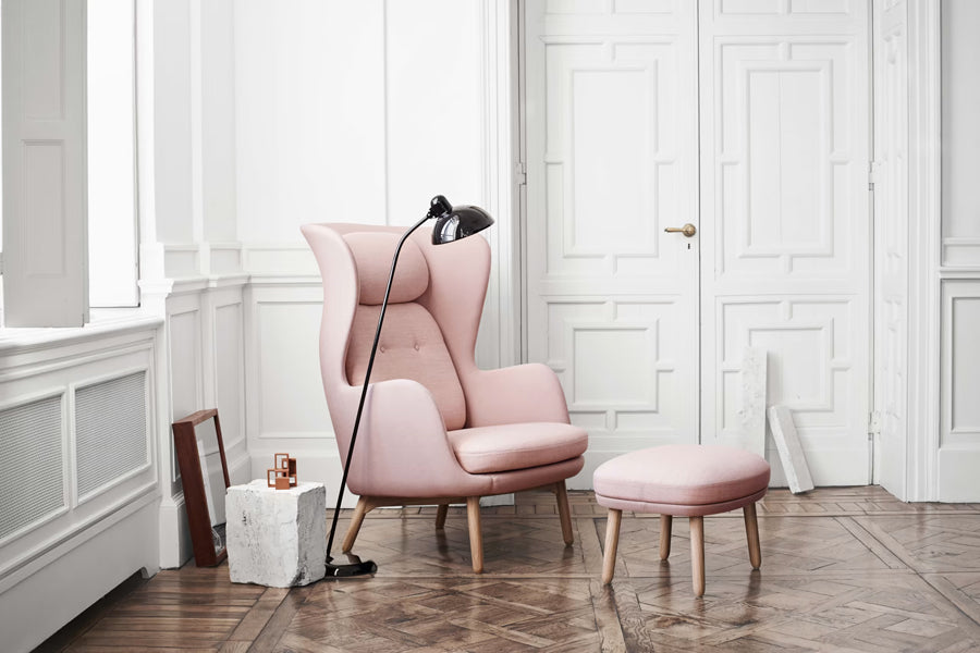 Ro Footstool by Fritz Hansen, showing ro footstool in live shot.