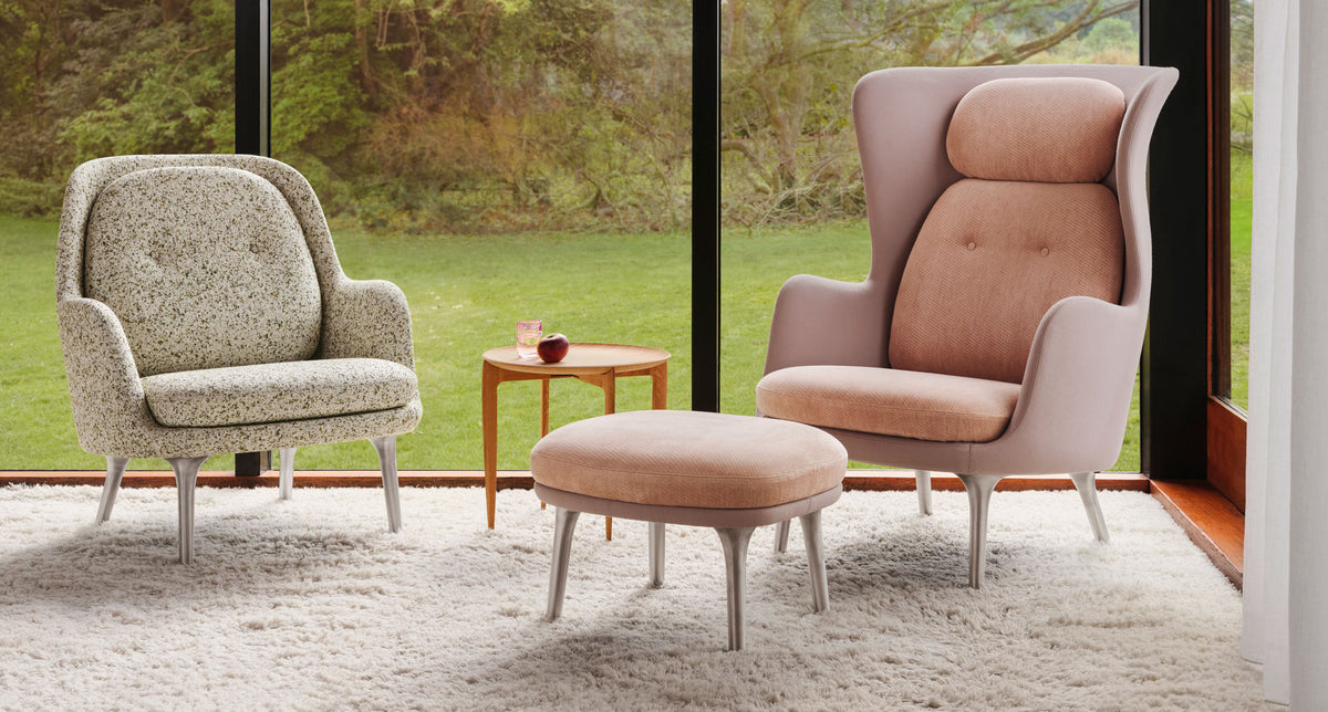 Ro Footstool by Fritz Hansen, showing ro footstool in live shot.