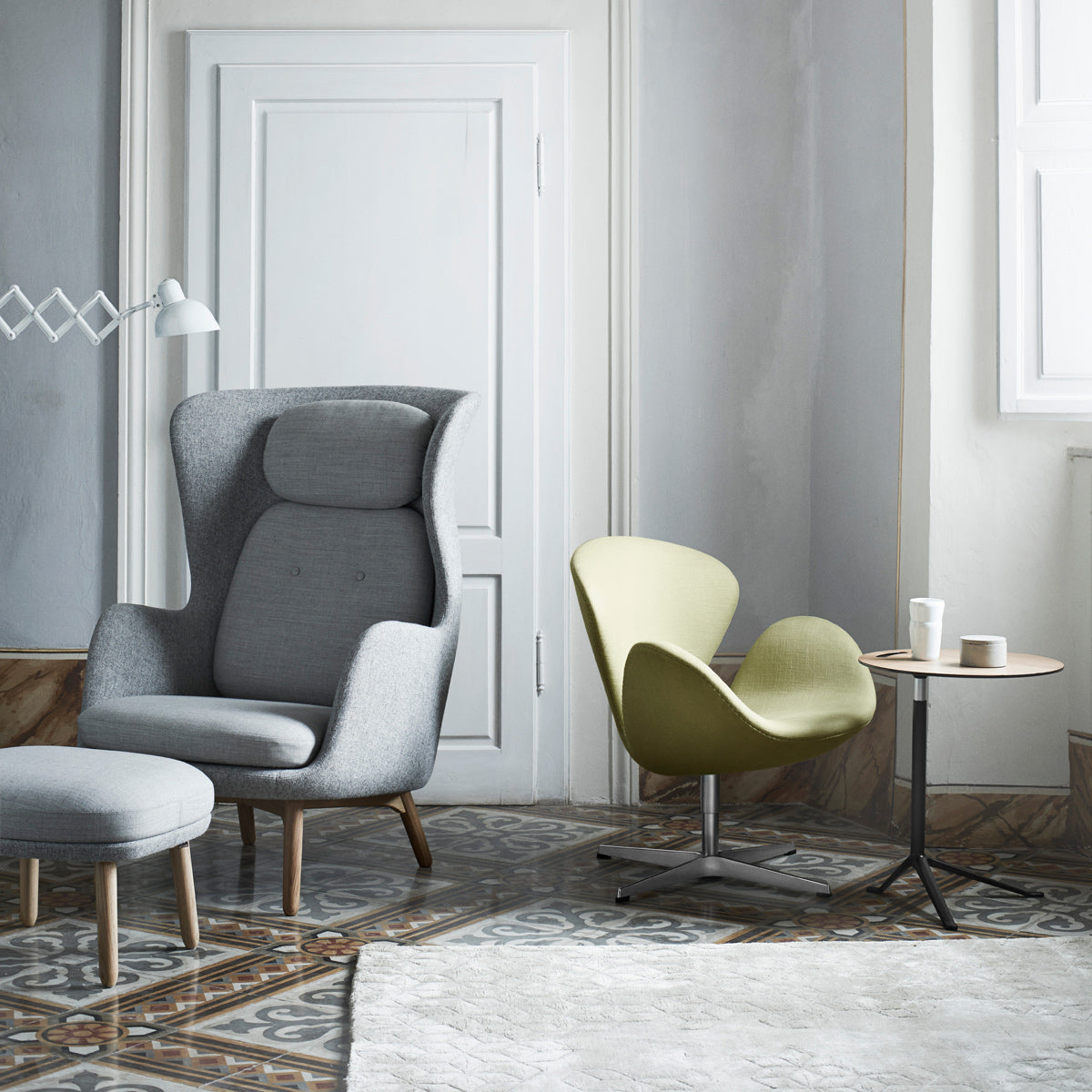 Ro Footstool by Fritz Hansen, showing ro footstool in live shot.