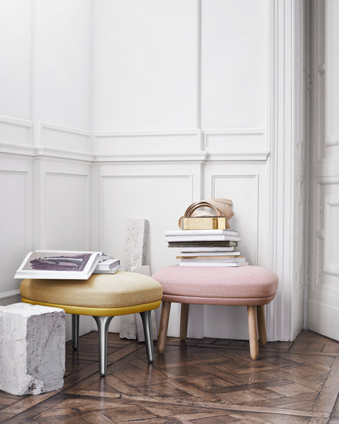 Ro Footstool by Fritz Hansen, showing ro footstools in live shot.