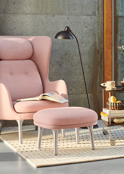 Ro Footstool by Fritz Hansen, showing ro footstool in live shot.