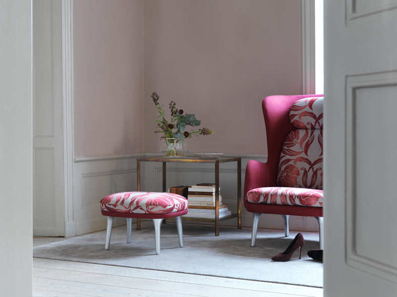 Ro Footstool by Fritz Hansen, showing ro footstool in live shot.