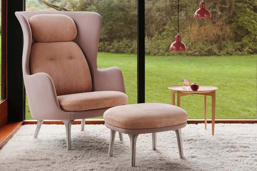 Ro Footstool by Fritz Hansen, showing ro footstool in live shot.